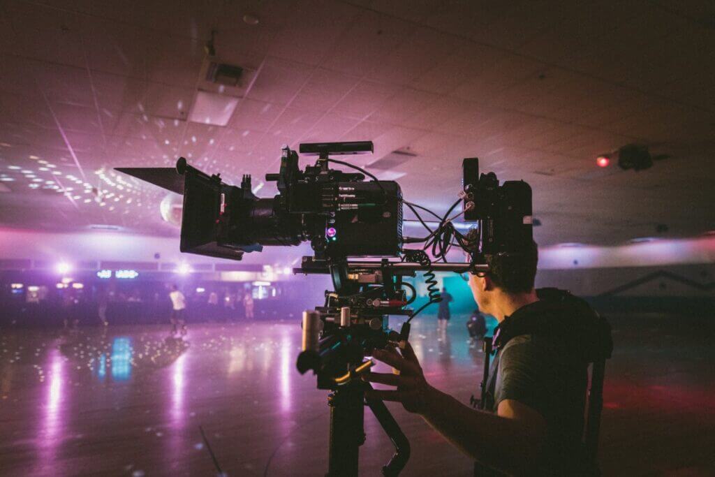 Crew filming at a skating rink