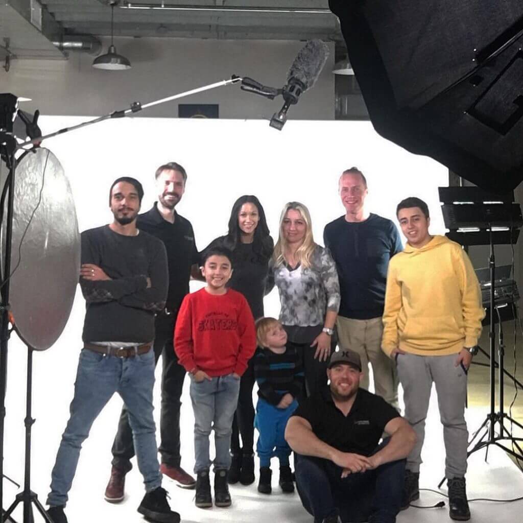 Video marketing crew and actors on film set